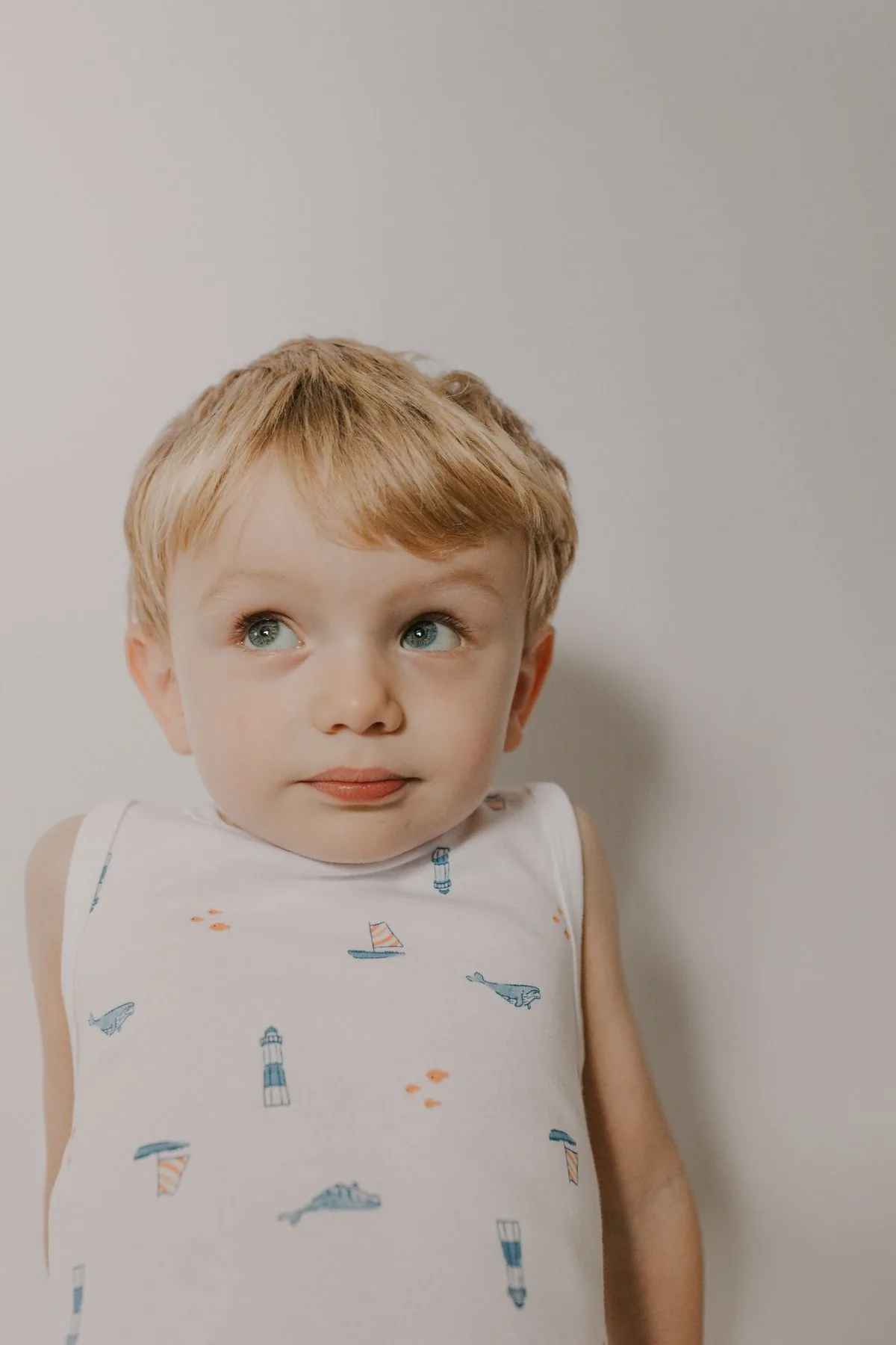 Before: toddler photographed against a plain white backdrop