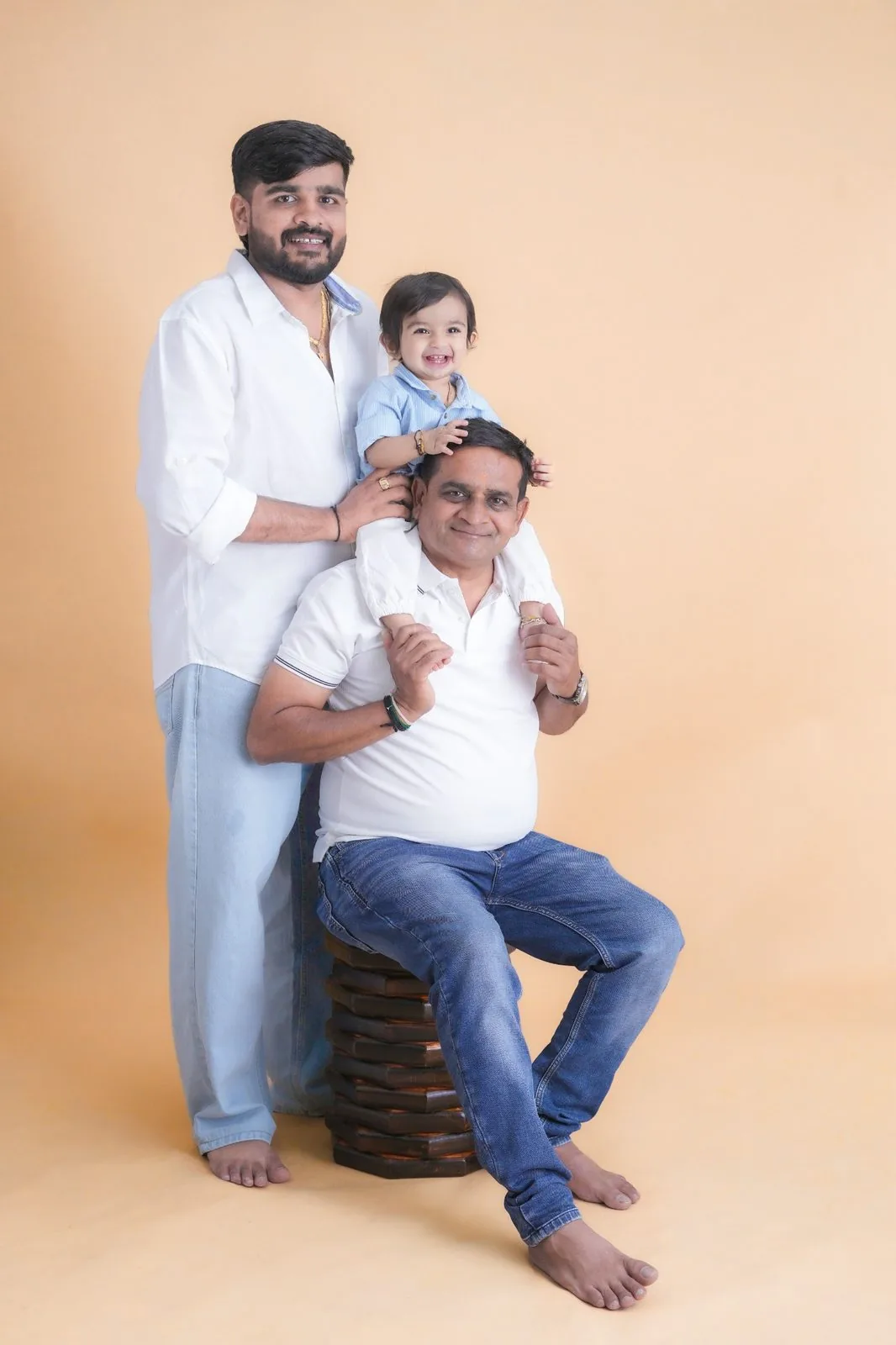 Before: everyday photo of three generations of one family posed against a plain studio backdrop